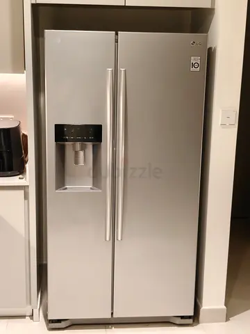 LG Side-by-Side Refrigerator with Water Dispenser  Ice Maker - Silver, Good Condition