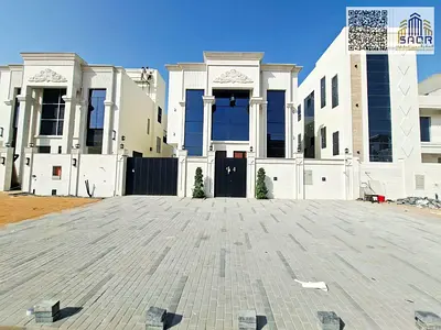 Classic 5-bedroom villa with a roof terrace for sale in Al Helio 2, Ajman. Includes registration fees and freehold ownership.