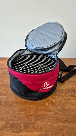 Portable charcoal grill in insulated carry bag (used)