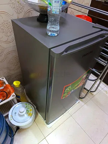 Compact single-door mini fridge in good condition