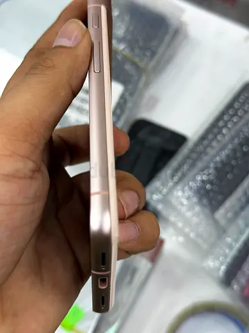 iPhone (rose gold) in good working condition — small cosmetic wear