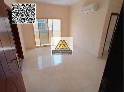 A 1-bedroom apartment with a living room for annual rent in Al Alia – Ajman, featuring a balcony and a practical layout, located in a lively area clos