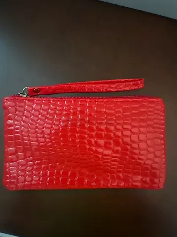 Woman’s red writs bag for wallet and phone