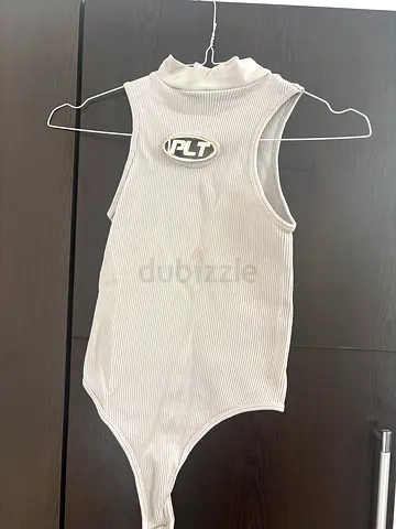 Light grey ribbed sleeveless bodysuit with mock neck (size unknown)