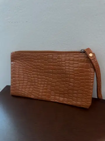 Woman’s brown wrist bag
