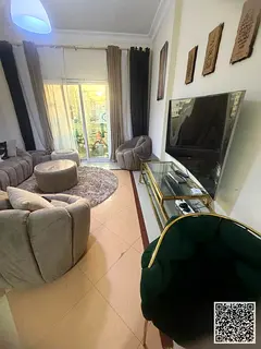 Luxurious two-bedroom apartment with a living room, fully furnished, and featuring a balcony. Locate