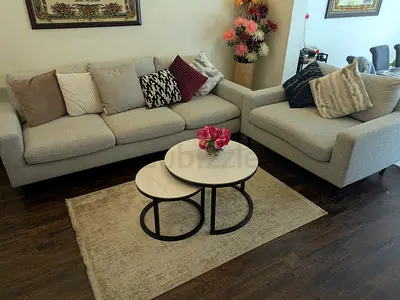 Light grey 3  2 seater sofa with cushions , coffee table .