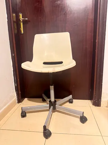 Simple white adjustable swivel office chair with wheels