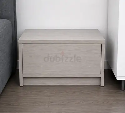 Simple light-grey wooden bedside table / nightstand