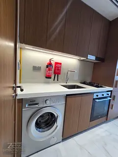 very nice studio with balconey kitchen appliances