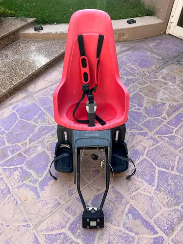Bobike rear-mounted child bike seat with straps and footrests