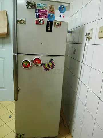 Used double-door refrigerator in good working condition