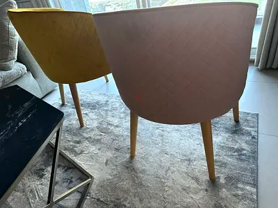 Pair of modern arm chairs with wooden legs
