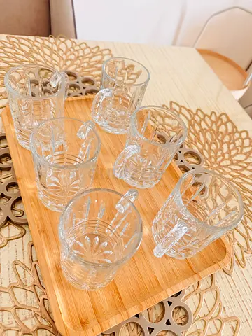 These are a set of six clear glass istikana mugs designed for tea or coffee.