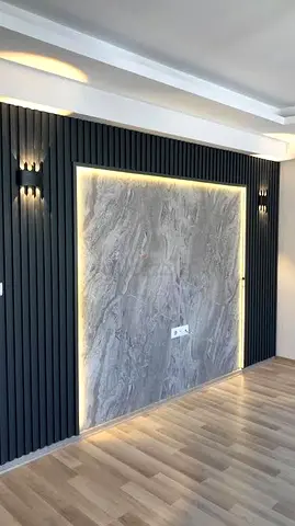 Modern living room feature wall panel with backlit marble centerpiece