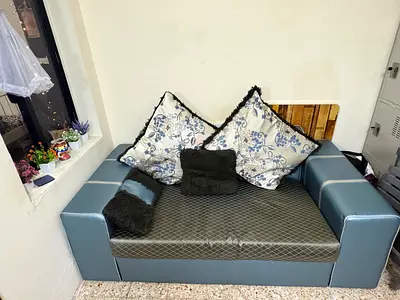 Compact three  two-seater sofa in blue faux leather with cushions washable cover.