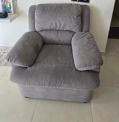 Single grey plush armchair - comfy and well maintained