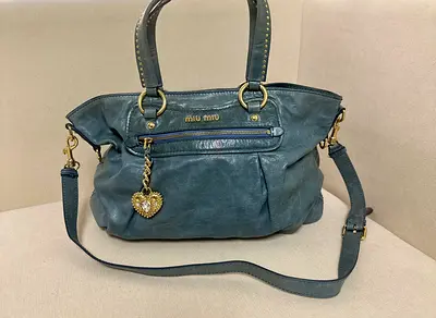 Preloved Miu Miu soft blue leather shoulder bag with heart charm-large