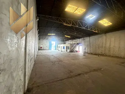 Warehouse for rent in Industrial Area 2, 10,000 sq ft, located on a main road, with offices and high-capacity electricity.