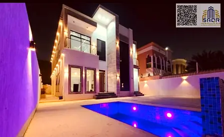 Villa for rent in Al Rawda 2, high-end finishing, with a spacious swimming pool and central air conditioning.
