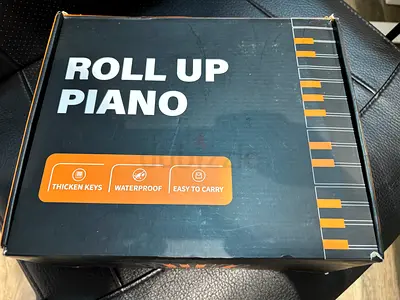 Portable 61-Key Roll-Up MIDI Keyboard - Gentle Use, Works Well. Excellent for travels