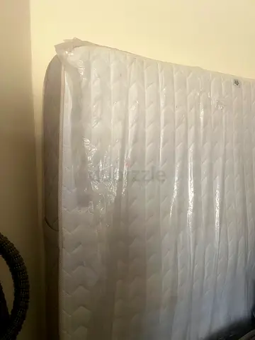 Double Mattress in Protective Cover - and disassembled bed ready for transport.