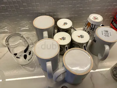Set of assorted coffee mugs, cups and glasses— gently used