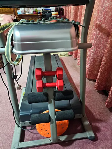 Compact Treadmill with Handrails and Small Dumbbells