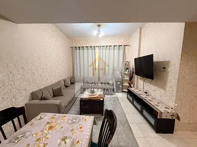 Luxuriously furnished two-bedroom apartment with a living room and private parking.