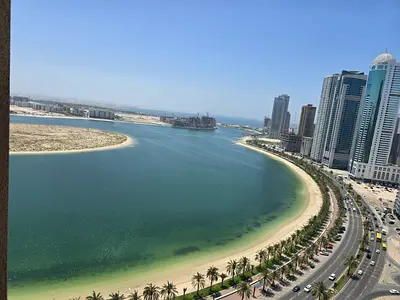 Two-bedroom apartment with balcony in Al Khan, two master rooms, free AC, 3 bathrooms, gym, pool and Al Qasba view included.