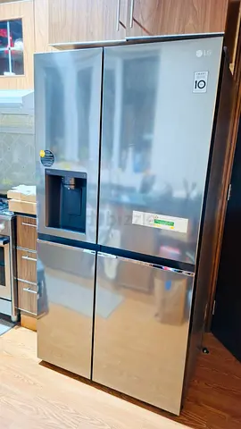 LG Stainless Steel 4-Door Side-by-Side Refrigerator with Water Dispenser - Good Condition