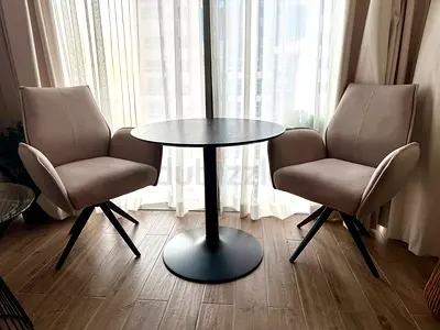 2 swivel dining chairs