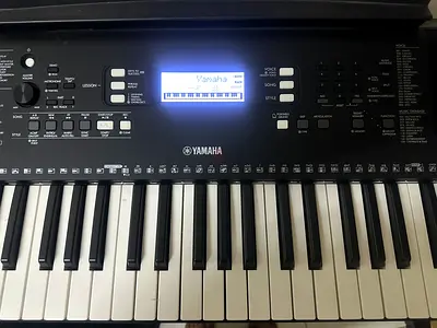 Yamaha PSR-E373 keyboard for sale in excellent condition. Includes keyboard stand, Yamaha carry bag,