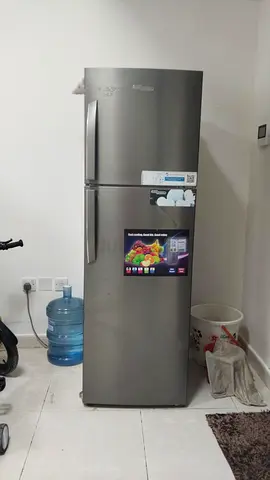 Silver double-door refrigerator with top freezer - good condition