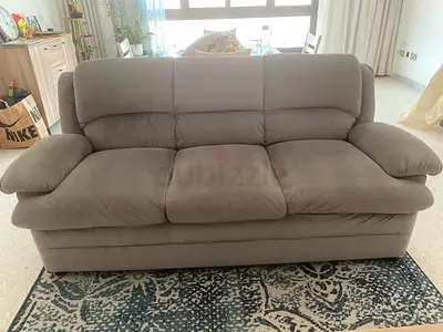 Three seater grey color sofa