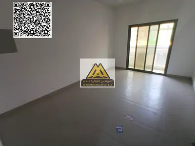 A 1-bedroom apartment with a living room for annual rent in Al Jurf 3 – Ajman, featuring central AC, a balcony, and a closed kitchen, located near the