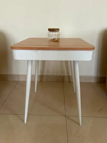 Small wooden-top side table with white legs - good condition