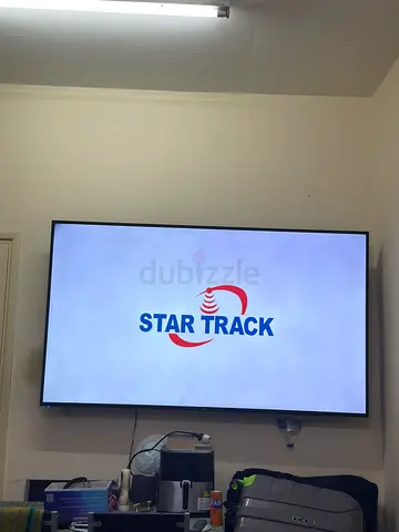 75 LED Smart TV mounted on wall - Good condition