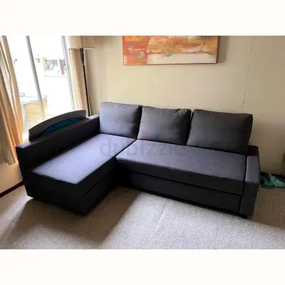 L-shaped dark grey fabric sofa with chaise - good condition