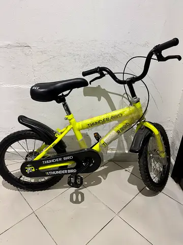 Yellow kids bicycle with training wheels — Thunderbird, need repair