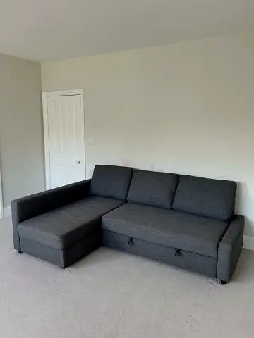 Dark grey L-shaped Sofa-bed with chaise (good condition)
