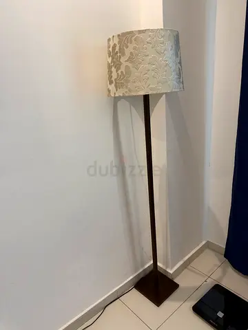 Lamp with lamp shade and yellow bulb