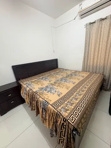 King size bed with two side tables and mattress