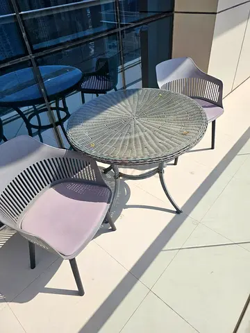 Outdoor rattan-style bistro table with 2 chairs