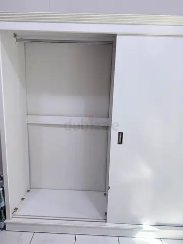White storage cabinet with slide door