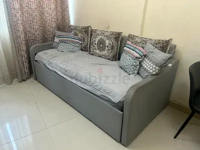 Grey fabric daybed with pull out bed  and cushions - good condition
