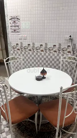 White Round Dining Table with 4 Metal Chairs - Compact Set