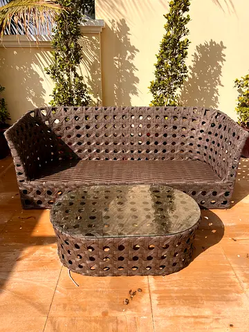 OUTDOOR WICKER SOFA AND TABLE.,