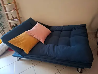 Blue convertible sofa bed in good condition