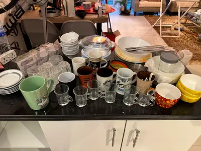 Mixed set of kitchenware: cups, mugs, bowls, plates  glasses - used